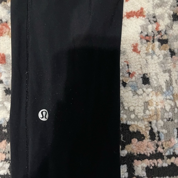 Black Lululemon Leggings with side pockets and back zipper - Picture 3 of 4